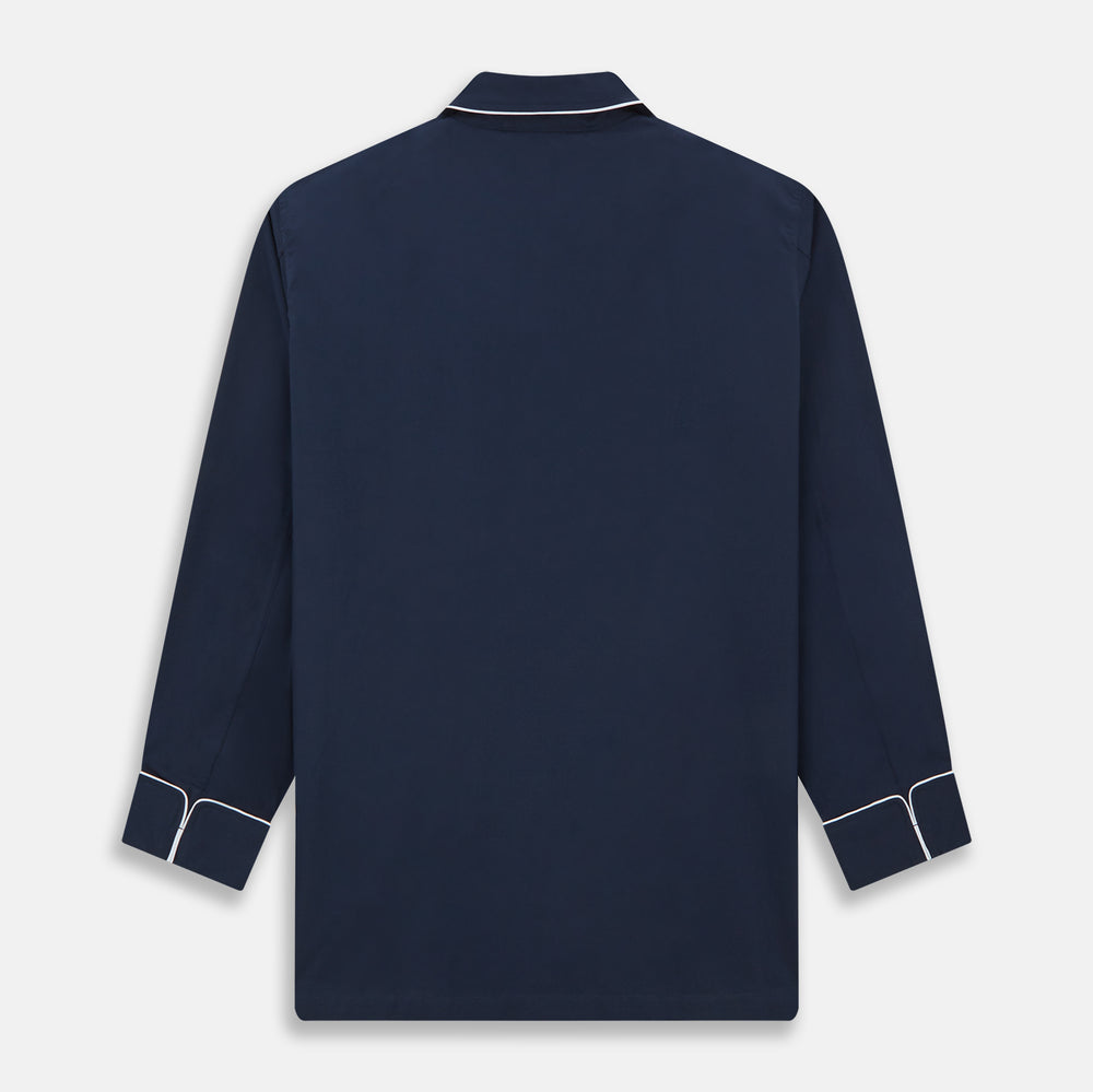 The Turnbull & Asser Navy Piped Cotton Pyjama Set features a navy blue long-sleeve top with white piping, front buttons, a chest pocket, and matching drawstring pants, all displayed on a white background.