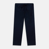 View 6 of product The Turnbull & Asser Navy Piped Cotton Pyjama Set features a navy blue long-sleeve top with white piping, front buttons, a chest pocket, and matching drawstring pants, all displayed on a white background.