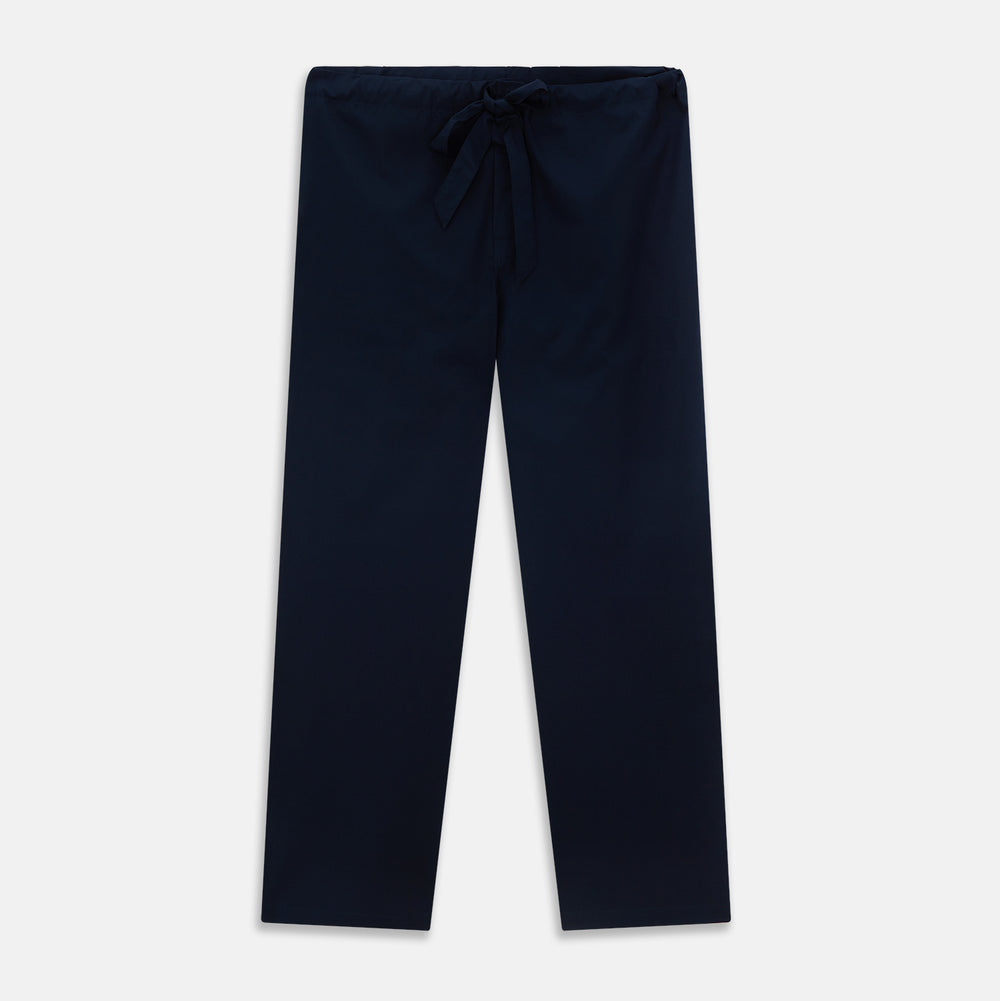 The Turnbull & Asser Navy Piped Cotton Pyjama Set features a navy blue long-sleeve top with white piping, front buttons, a chest pocket, and matching drawstring pants, all displayed on a white background.