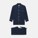 The Turnbull & Asser Navy Piped Cotton Pyjama Set features a navy blue long-sleeve top with white piping, front buttons, a chest pocket, and matching drawstring pants, all displayed on a white background.
