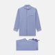 The Blue Piped End-on-End Cotton Pyjama Set by Turnbull & Asser features light blue long sleeves, red piping, front buttons, chest pocket, and matching drawstring pants—luxurious sleepwear laid flat on a white background.