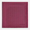 View 3 of product A folded Floral Burgundy Pocket Square in Silk by Turnbull & Asser UK, adorned with pink floral geometric motifs and featuring the Turnbull & Asser logo in the bottom right corner.