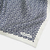 View 2 of product A refined double-sided design, the Floral White Pocket Square in Silk by Turnbull & Asser UK features a small blue floral pattern on white silk, neatly folded to display both its intricate front and bordered corner—adding subtle elegance to any ensemble.