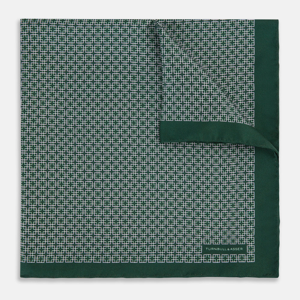 Turnbull & Asser UK Geometric Green Forest Green Pocket Square in Silk featuring a white geometric motif and a solid green border.