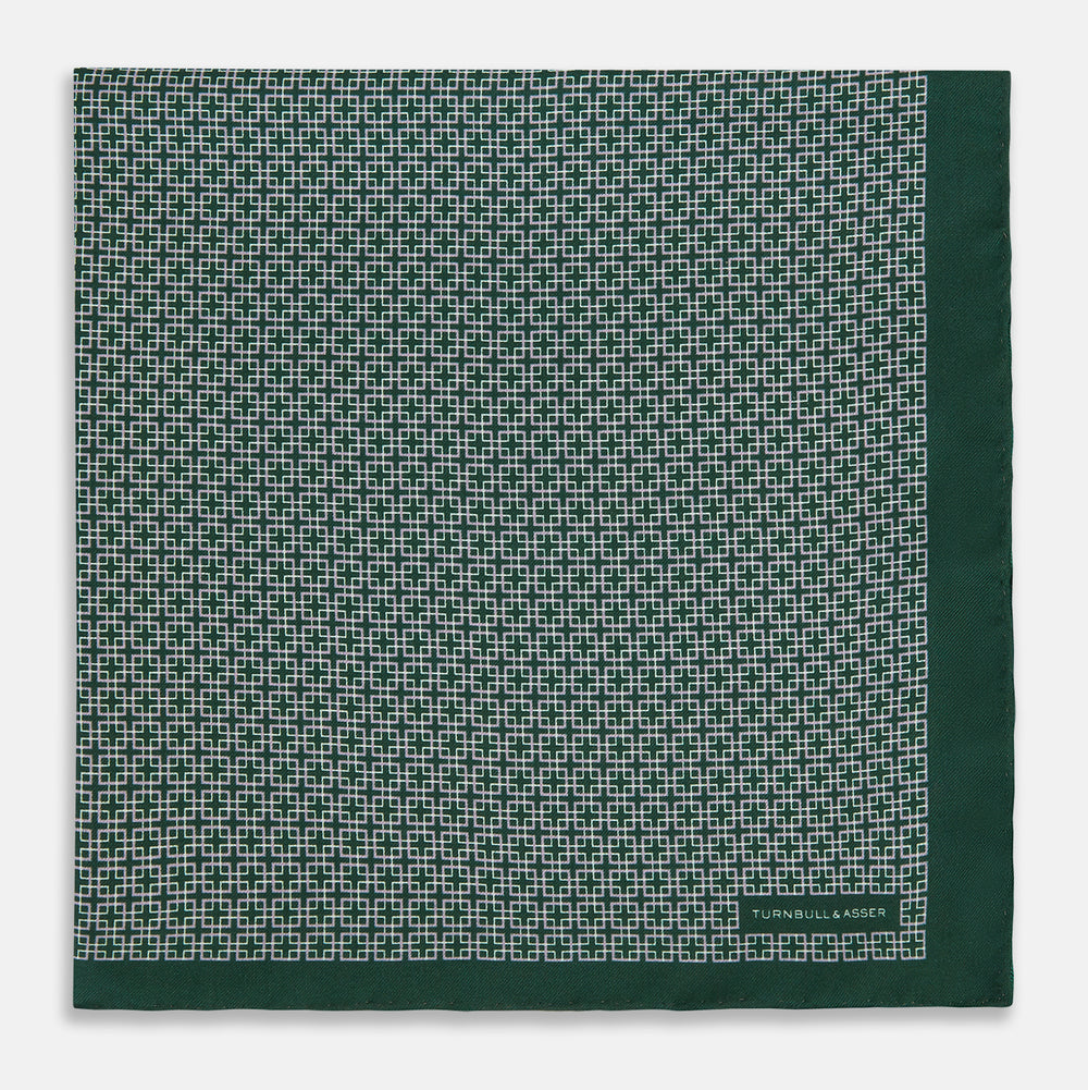 Turnbull & Asser UK Geometric Green Forest Green Pocket Square in Silk featuring a white geometric motif and a solid green border.