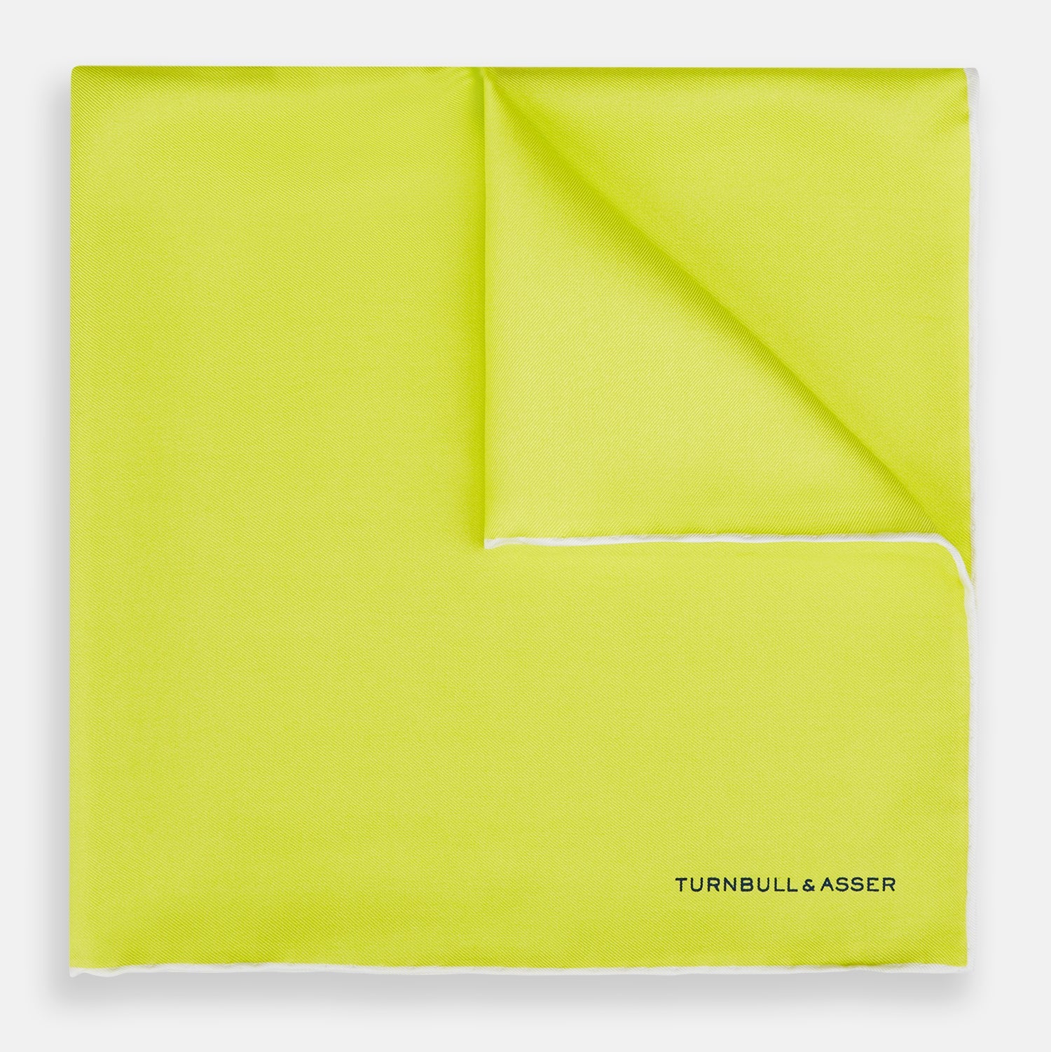 View 1 of product The Canary Yellow Piped Silk Pocket Square by Turnbull & Asser features white edges and black branding in the bottom right corner, making it a perfect accessory for formal attire. Shown on a plain white background.