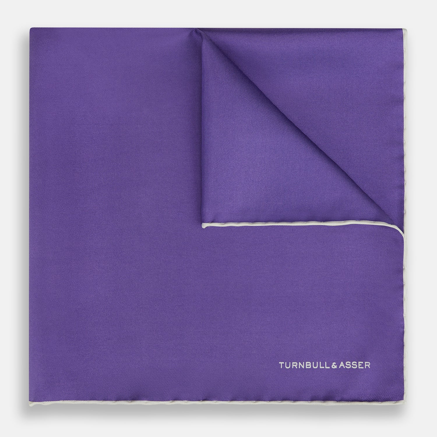 View 1 of product The Turnbull & Asser Violet and Ecru Piped Silk Pocket Square features a stitched edge and white brand logo, making it an elegant addition to formalwear.