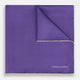 The Turnbull & Asser Violet and Ecru Piped Silk Pocket Square features a stitched edge and white brand logo, making it an elegant addition to formalwear.