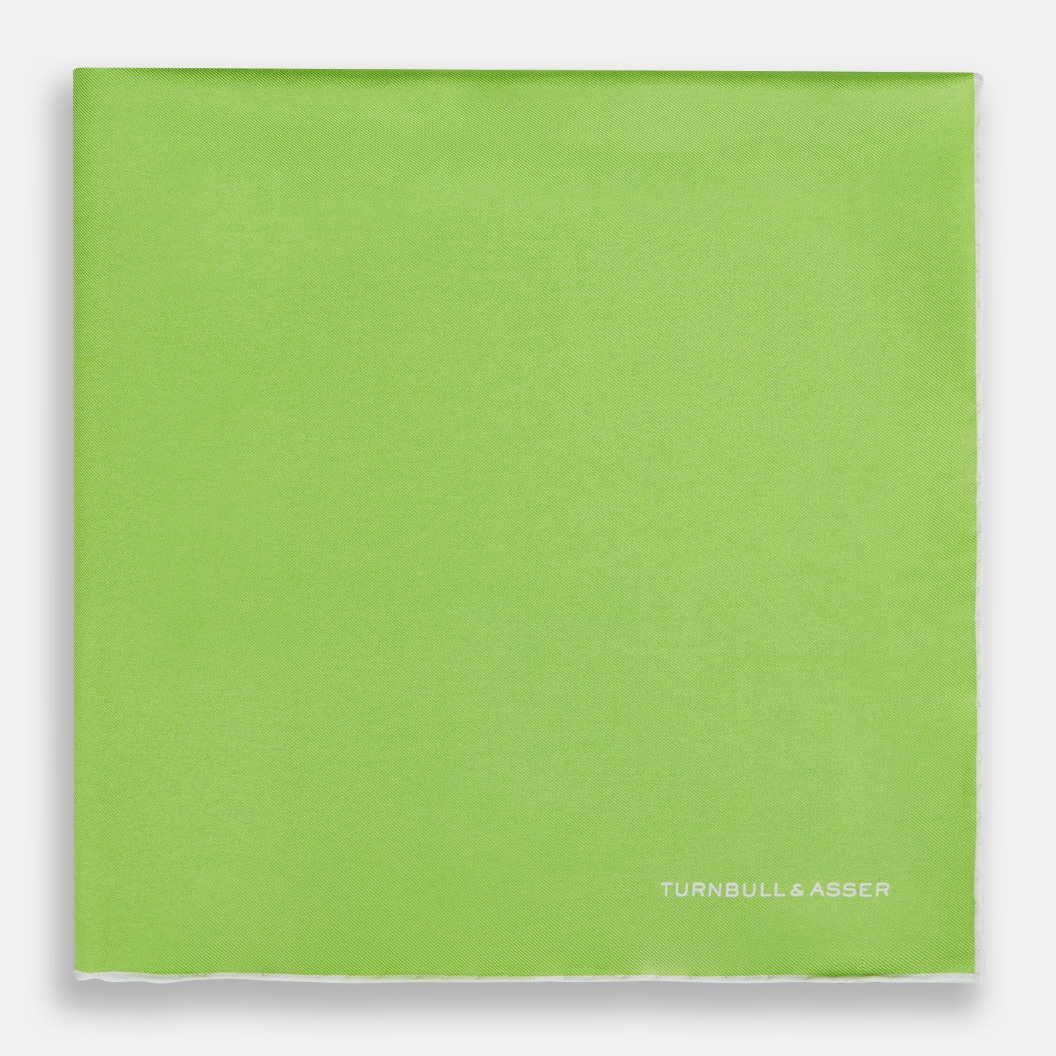 View 3 of product The Lime Green and Ecru Piped Silk Pocket Square by Turnbull & Asser adds a refined touch to any formal look.
