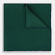 The Turnbull & Asser Petrol Green Piped Silk Pocket Square features a visible stitched edge and a discreet blue logo on the turned-down corner, adding an elegant accent to formal attire.