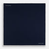 View 4 of product The Midnight Blue Piped Silk Pocket Square from Turnbull & Asser features crisp white trim and subtle branding, making it the ideal accessory to elevate your formal look.