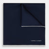 View 1 of product The Midnight Blue Piped Silk Pocket Square from Turnbull & Asser features crisp white trim and subtle branding, making it the ideal accessory to elevate your formal look.
