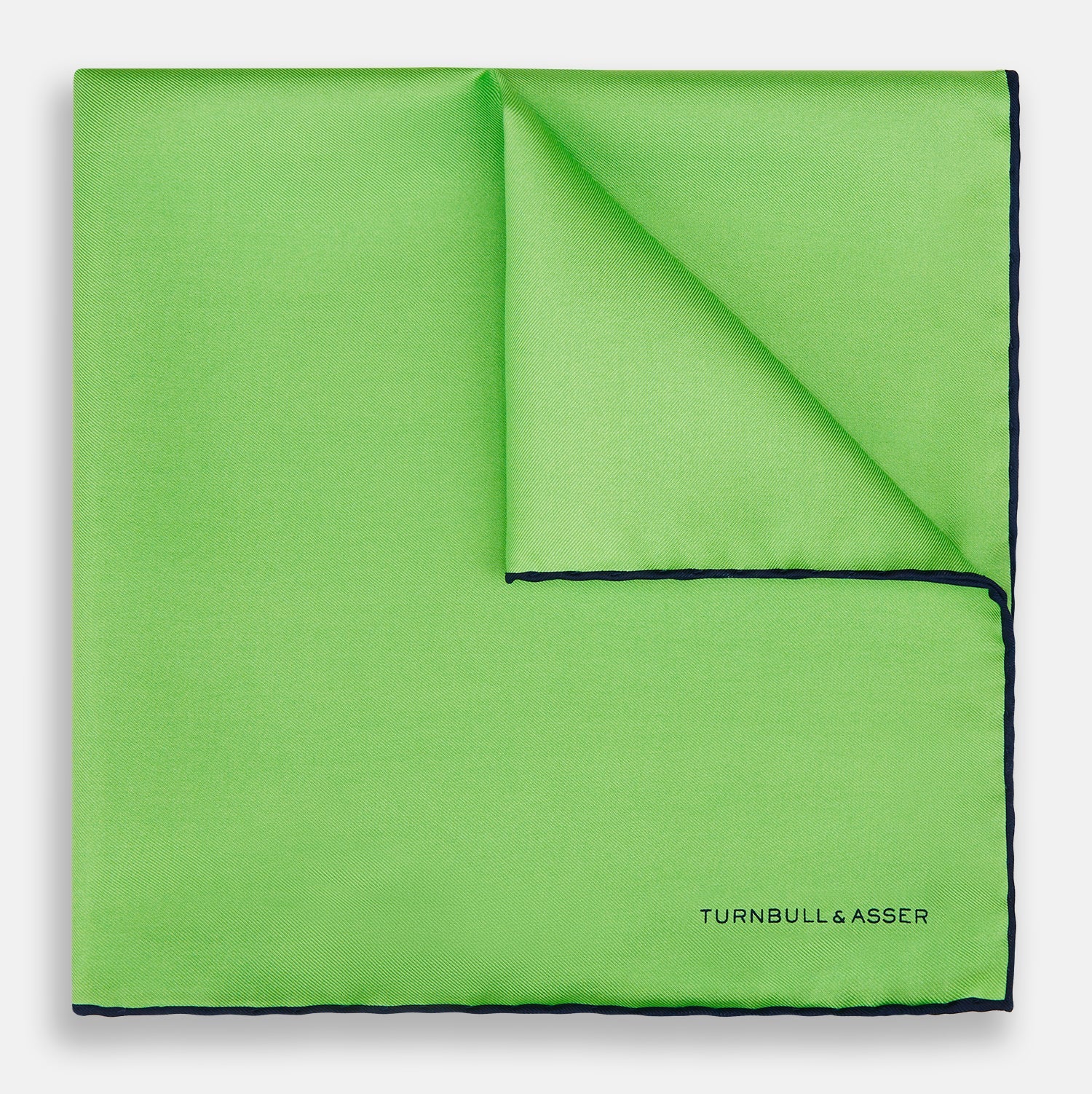 View 1 of product A neatly folded Turnbull & Asser LIGHT GREEN AND BLACK PIPED SILK POCKET SQUARE—ideal for elevating formal attire.