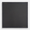View 4 of product A grey and lime spot silk pocket square by Turnbull & Asser, featuring evenly spaced dots and the brand's logo in one corner—perfect for adding a stylish touch to formal attire.