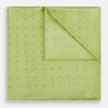 View 1 of product The Turnbull & Asser Melon Green and Lilac Spot Silk Pocket Square features evenly spaced lilac dots and the brand's name in one corner—a refined accessory for formal attire.