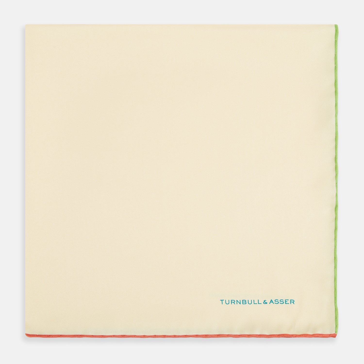 View 3 of product The Turnbull & Asser Ecru and Multicoloured Piped Silk Pocket Square features green and orange piping, blue "TURNBULL & ASSER" embroidery in the lower right, and a folded corner—a refined accessory for formal wear.