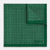 View 3 of product The Rosette Green Pocket Square in Silk by Turnbull & Asser UK features a small geometric medallion pattern and is shown folded to display a contrasting fine black-and-white design on the reverse side.
