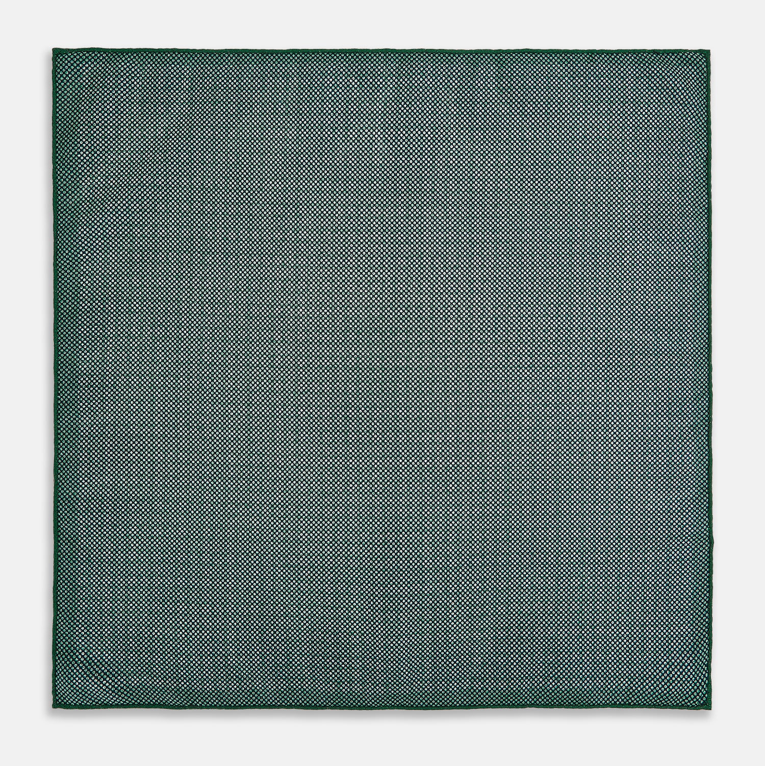 View 6 of product The Rosette Green Pocket Square in Silk by Turnbull & Asser UK features a small geometric medallion pattern and is shown folded to display a contrasting fine black-and-white design on the reverse side.