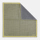 The Rosette Yellow Pocket Square in Silk by Turnbull & Asser UK features a square design with a yellow border, adorned with a grid of small black and white circles. One corner is neatly folded to reveal a reverse side in a refined black and white micro-checkered pattern, while subtle geometric medallions lend an added touch of elegance to the overall look.