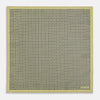 View 5 of product The Rosette Yellow Pocket Square in Silk by Turnbull & Asser UK features a square design with a yellow border, adorned with a grid of small black and white circles. One corner is neatly folded to reveal a reverse side in a refined black and white micro-checkered pattern, while subtle geometric medallions lend an added touch of elegance to the overall look.