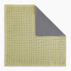 View 6 of product A yellow silk pocket square featuring a small black grid pattern of dotted squares, neatly folded at one corner. "Turnbull & Asser UK" is printed in the bottom right corner.