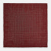 View 6 of product The Turnbull & Asser UK Checked Burgundy Pocket Square in Silk features a sophisticated burgundy hue with a subtle grid pattern. It's displayed folded at one corner to reveal a contrasting small checkered design on the reverse, showcasing its refined double-sided craftsmanship.
