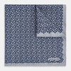 View 2 of product The Turnbull & Asser UK Floral Blue Pocket Square in Silk showcases a refined double-sided design, with a clustered dot pattern in blue and white on the front and a delicate fine dotted motif on the back. Presented with one corner elegantly folded, it exudes sophisticated style.