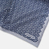 View 3 of product The Turnbull & Asser UK Floral Blue Pocket Square in Silk showcases a refined double-sided design, with a clustered dot pattern in blue and white on the front and a delicate fine dotted motif on the back. Presented with one corner elegantly folded, it exudes sophisticated style.