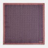 View 5 of product The Floral Pink Pocket Square in Silk by Turnbull & Asser UK showcases a refined pattern with a pink floral design and a contrasting border. The top right corner is elegantly folded to reveal the reverse side’s complementary blue and white dotted motif, emphasizing its double-sided versatility.