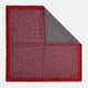 Turnbull & Asser UK’s Geometric Red Pocket Square in Silk features a small white checkered pattern and a cleverly flipped corner to showcase its contrasting black and white micro-dot reverse design.