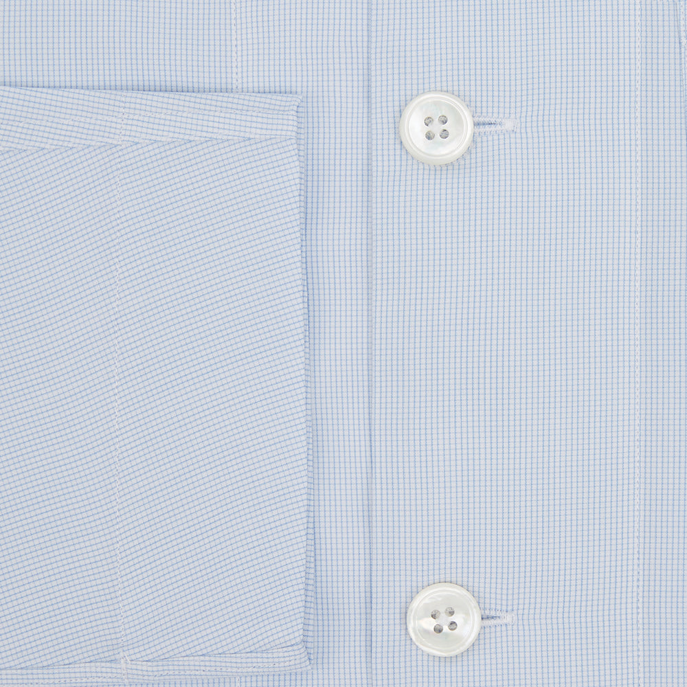 The Turnbull & Asser Pale Blue Fine Micro Check Pyjama Shirt features long sleeves, a notched collar, and a chest pocket—styled flat on white, ideal for elegant nightwear.