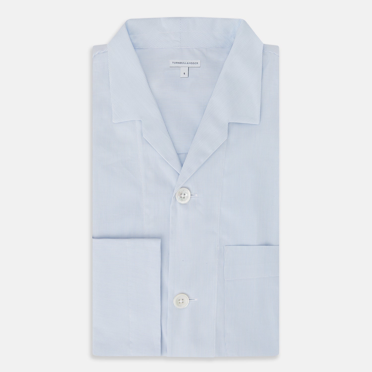 View 5 of product The Turnbull & Asser Pale Blue Fine Micro Check Pyjama Shirt features long sleeves, a notched collar, and a chest pocket—styled flat on white, ideal for elegant nightwear.