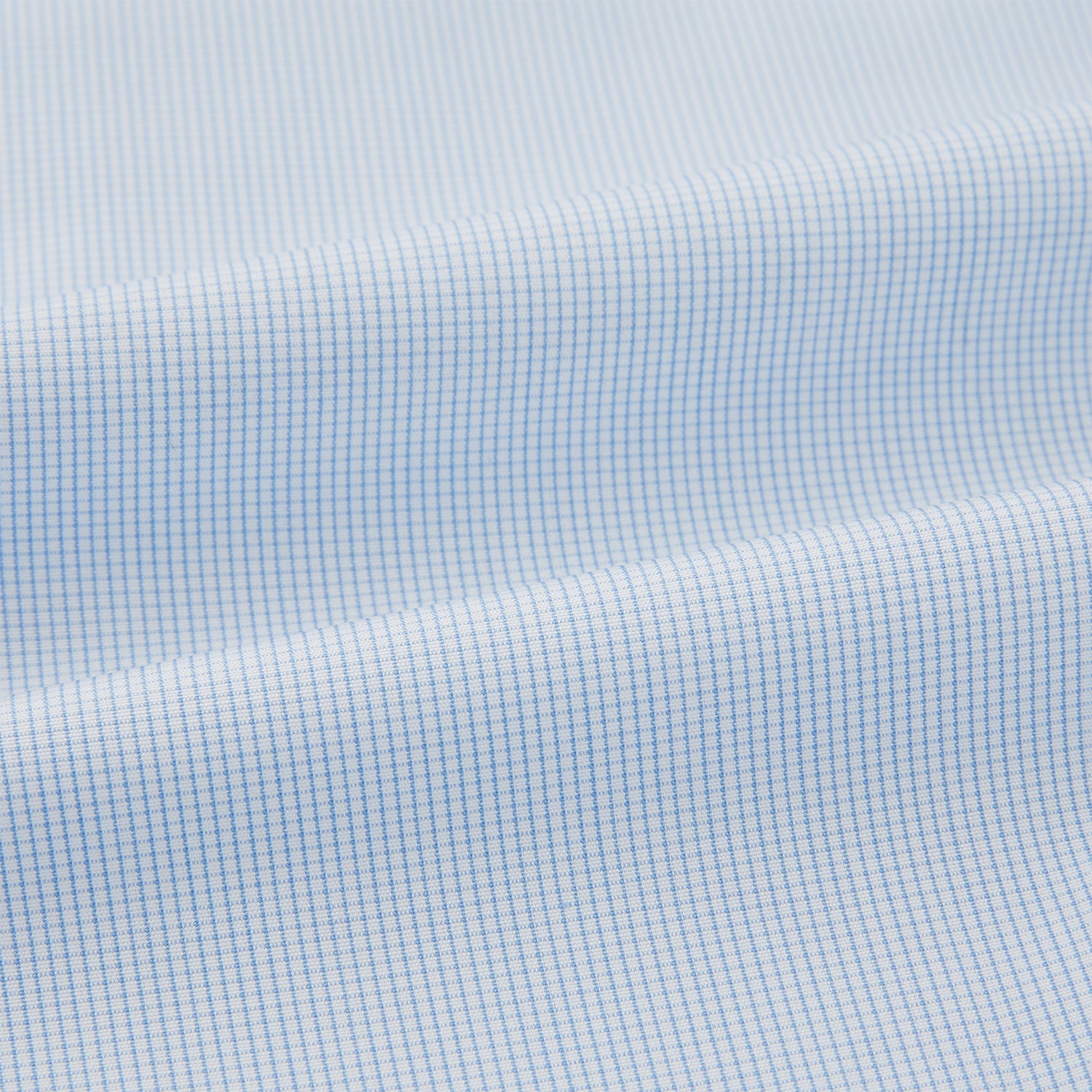 View 6 of product The Turnbull & Asser Pale Blue Fine Micro Check Pyjama Shirt features long sleeves, a notched collar, and a chest pocket—styled flat on white, ideal for elegant nightwear.