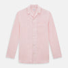 View 1 of product The Turnbull & Asser Pale Pink Linen Pyjama Shirt features long sleeves, a chest pocket, and a classic button-up design—ideal for stylish nightwear or relaxed homewear. Shown laid flat on a white background.