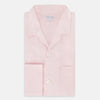 View 5 of product The Turnbull & Asser Pale Pink Linen Pyjama Shirt features long sleeves, a chest pocket, and a classic button-up design—ideal for stylish nightwear or relaxed homewear. Shown laid flat on a white background.