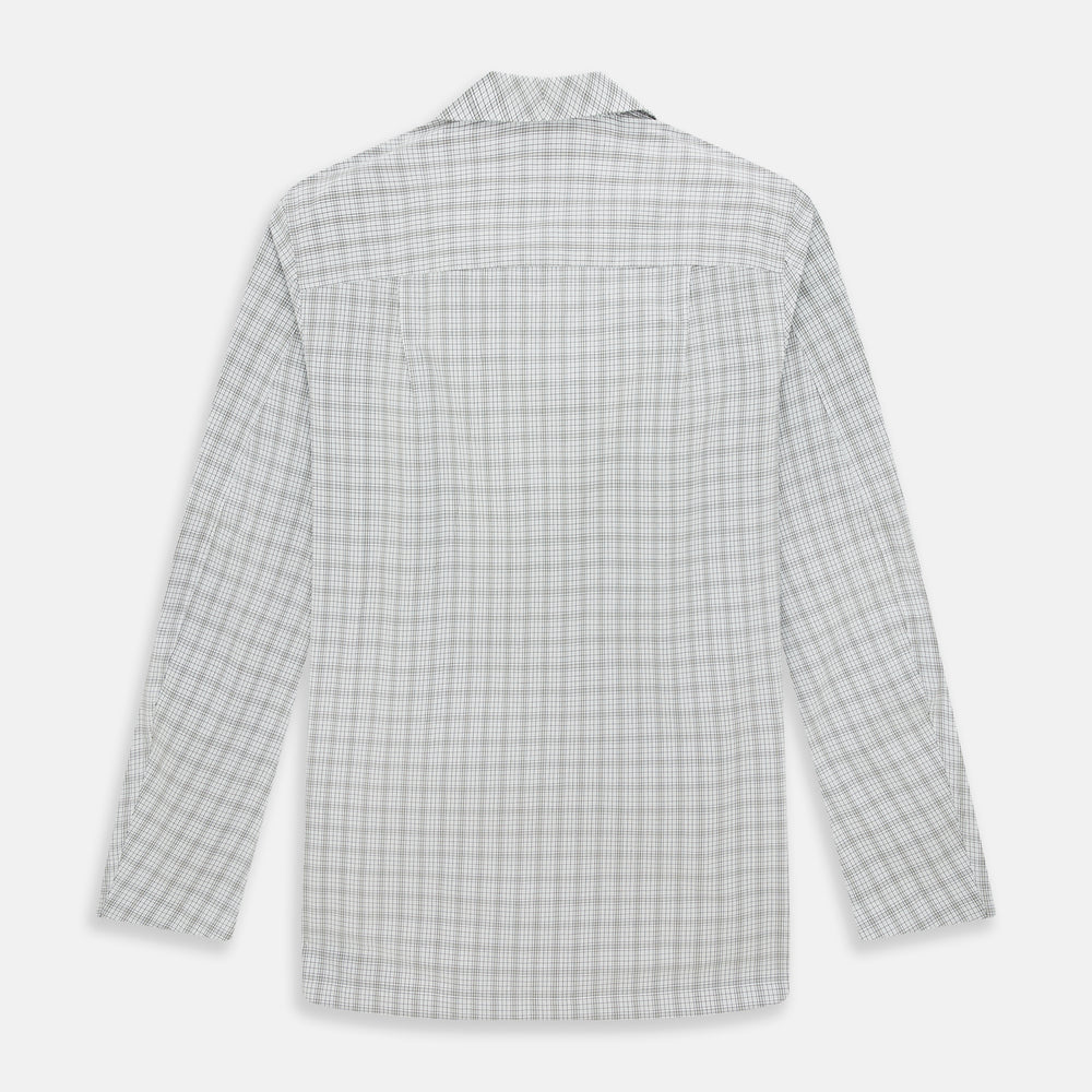 The Turnbull & Asser Grey Fine Multi Graph Check Pyjama Shirt features light grey and white checks, a single chest pocket, and long sleeves—ideal for stylish nightwear or as a classic pyjama shirt. Shown on a white background.