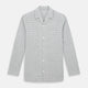 The Turnbull & Asser Grey Fine Multi Graph Check Pyjama Shirt features light grey and white checks, a single chest pocket, and long sleeves—ideal for stylish nightwear or as a classic pyjama shirt. Shown on a white background.