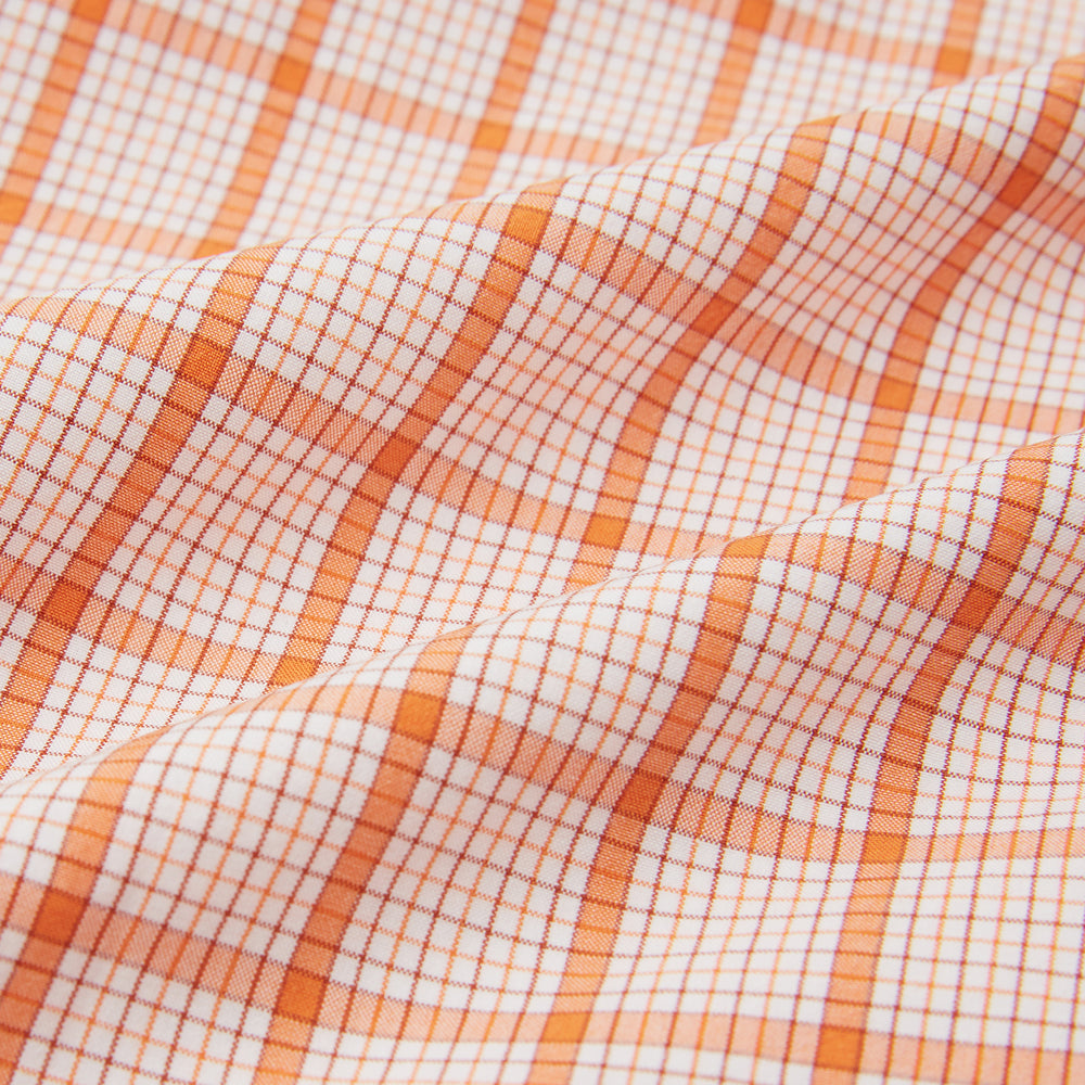 The Orange Graph Overlay Check Pyjama Shirt by Turnbull & Asser features long sleeves, a notched collar, and a front chest pocket, shown here laid flat on a white background.