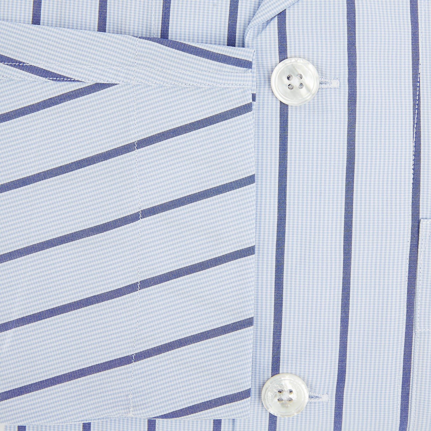 View 4 of product The Turnbull & Asser Blue Track Stripe Pyjama Shirt features a collar, white buttons, chest pocket, and vertical navy stripes—an elegant and comfortable loungewear option perfect for stylish nightwear.