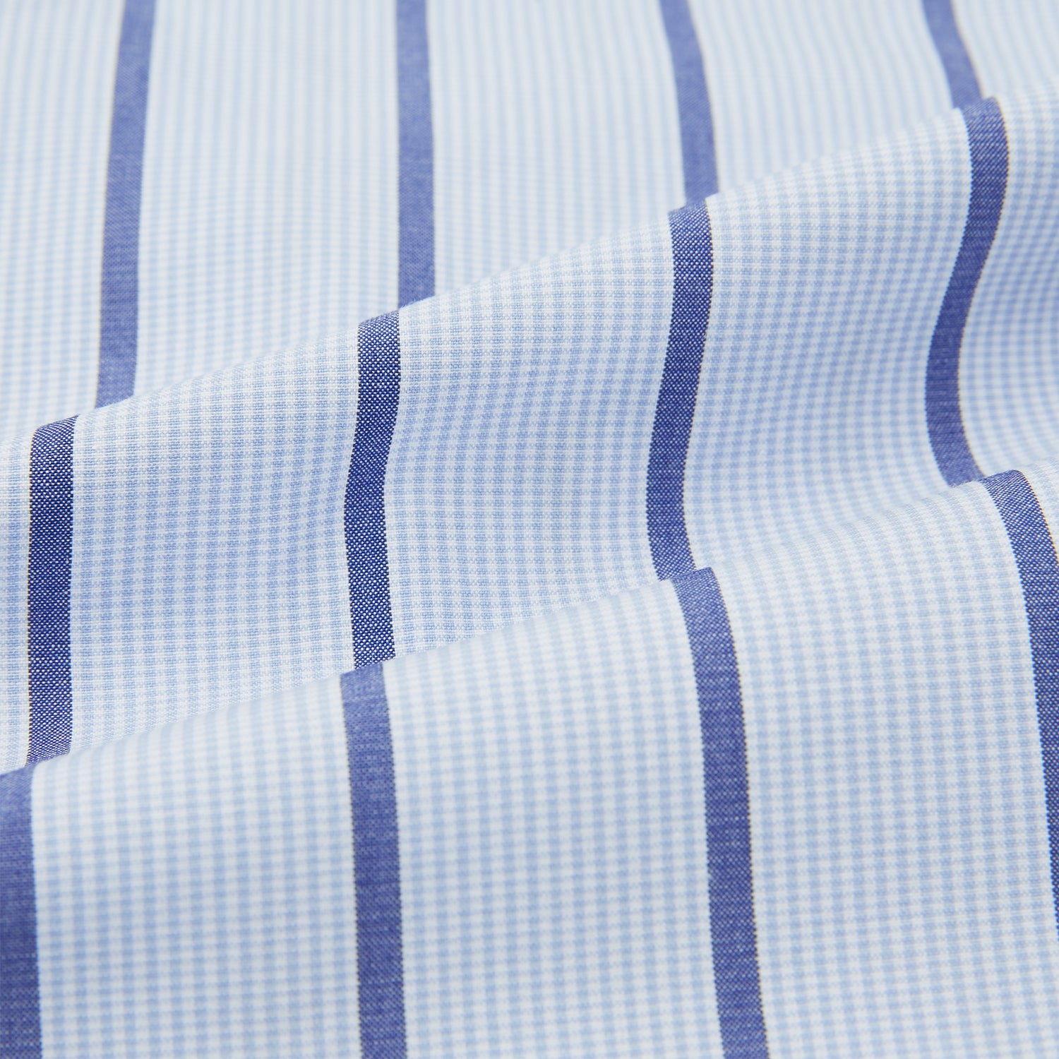 View 6 of product The Turnbull & Asser Blue Track Stripe Pyjama Shirt features a collar, white buttons, chest pocket, and vertical navy stripes—an elegant and comfortable loungewear option perfect for stylish nightwear.