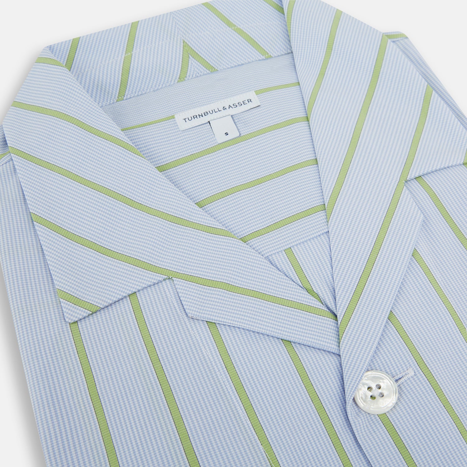 View 2 of product The Turnbull & Asser Light Green and Blue Stripe Pyjama Shirt features long sleeves, a front chest pocket, and elegant loungewear style, shown on a plain white background.
