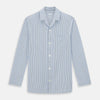 View 1 of product The Turnbull & Asser Blue Shadow Pinstripe Pyjama Shirt features blue and white vertical stripes, a chest pocket, and long sleeves—ideal for elegant homewear, shown against a white background.