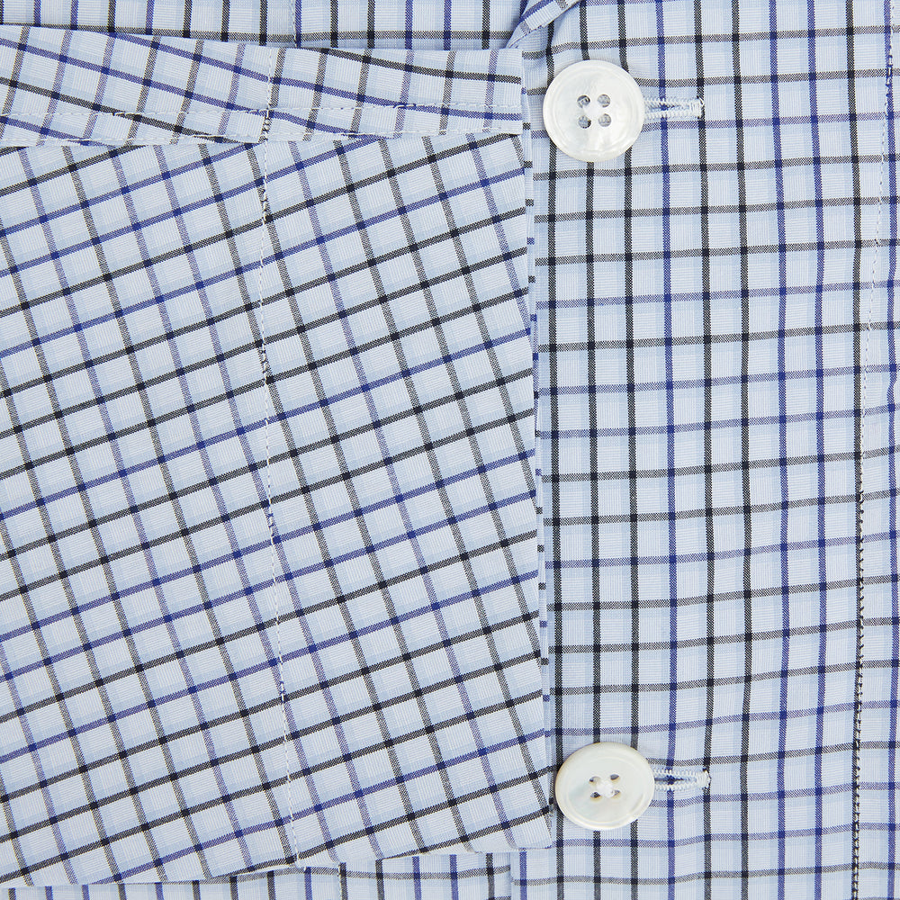 The Turnbull & Asser Blue Shadow Check Pyjama Shirt features long sleeves, a button-up front, collar, and chest pocket—ideal for refined loungewear or stylish nightwear.