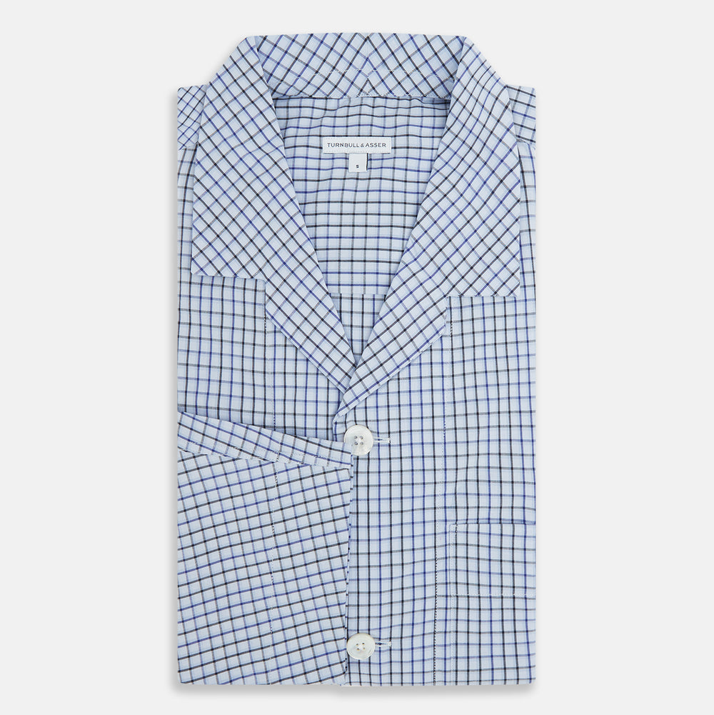 The Turnbull & Asser Blue Shadow Check Pyjama Shirt features long sleeves, a button-up front, collar, and chest pocket—ideal for refined loungewear or stylish nightwear.