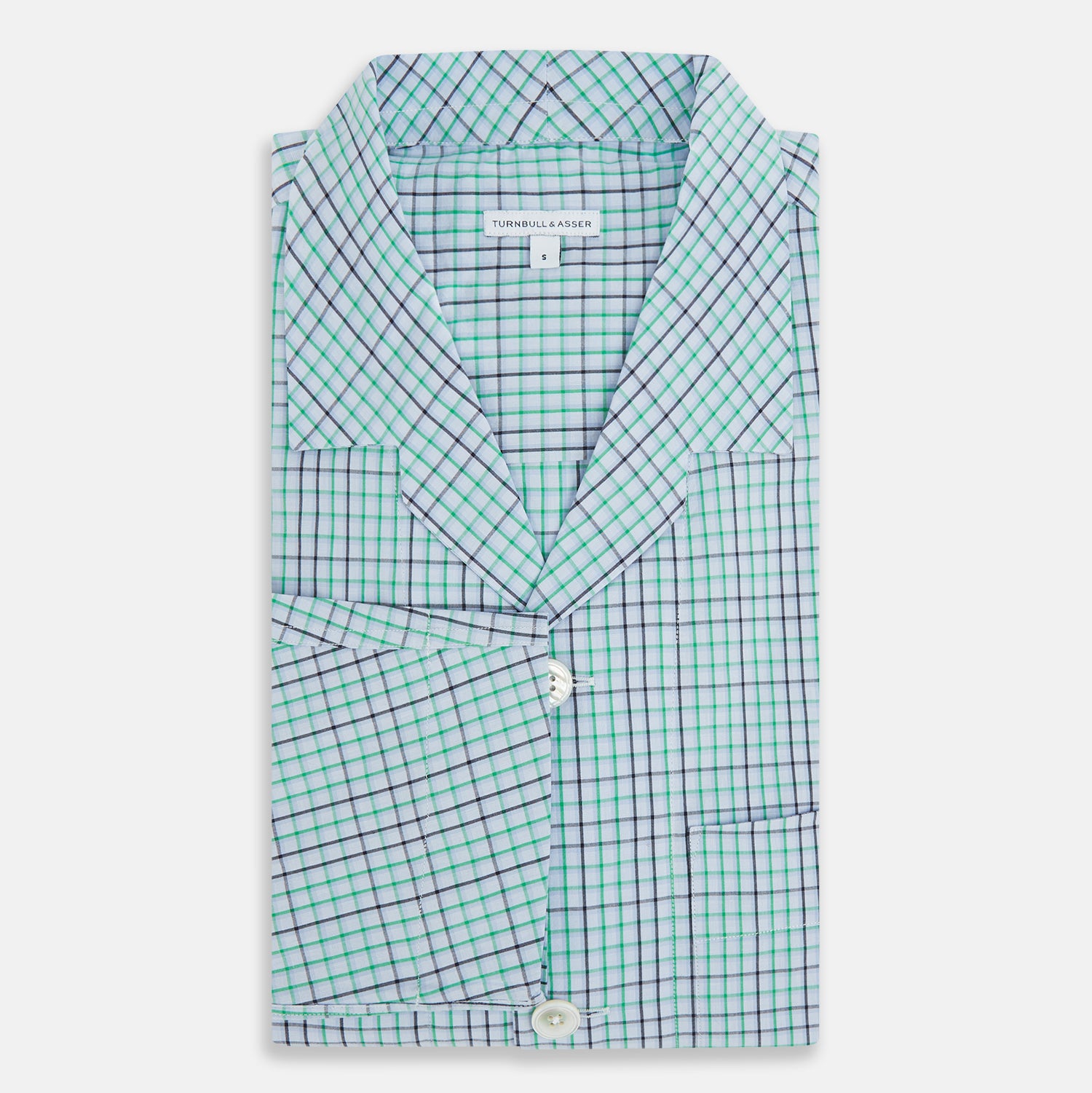 View 5 of product The Turnbull & Asser Green and Blue Shadow Check Pyjama Shirt, with a collar and chest pocket, is perfect loungewear or nightwear; shown laid flat on a white background.