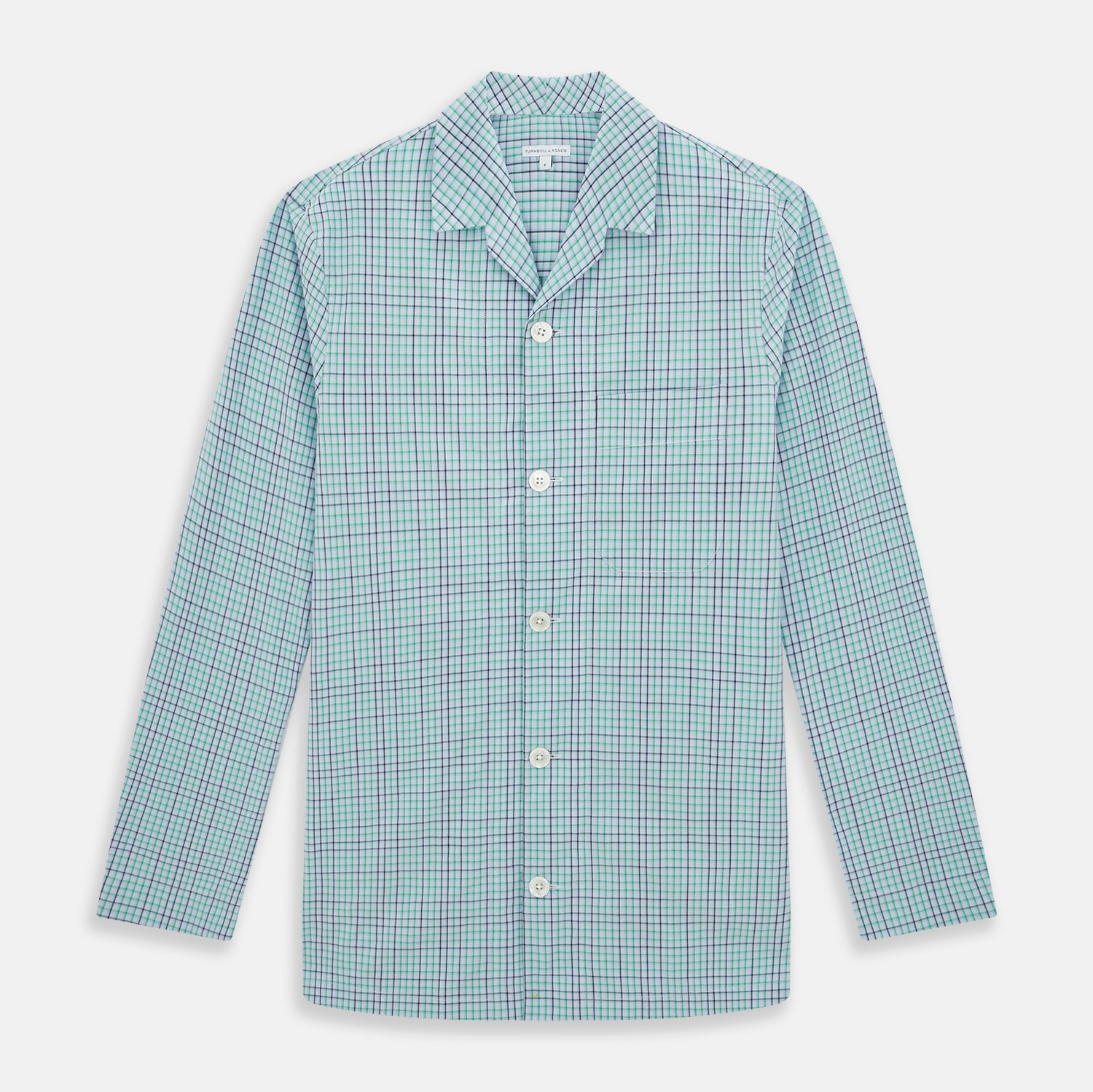 View 1 of product The Turnbull & Asser Green and Blue Shadow Check Pyjama Shirt, with a collar and chest pocket, is perfect loungewear or nightwear; shown laid flat on a white background.