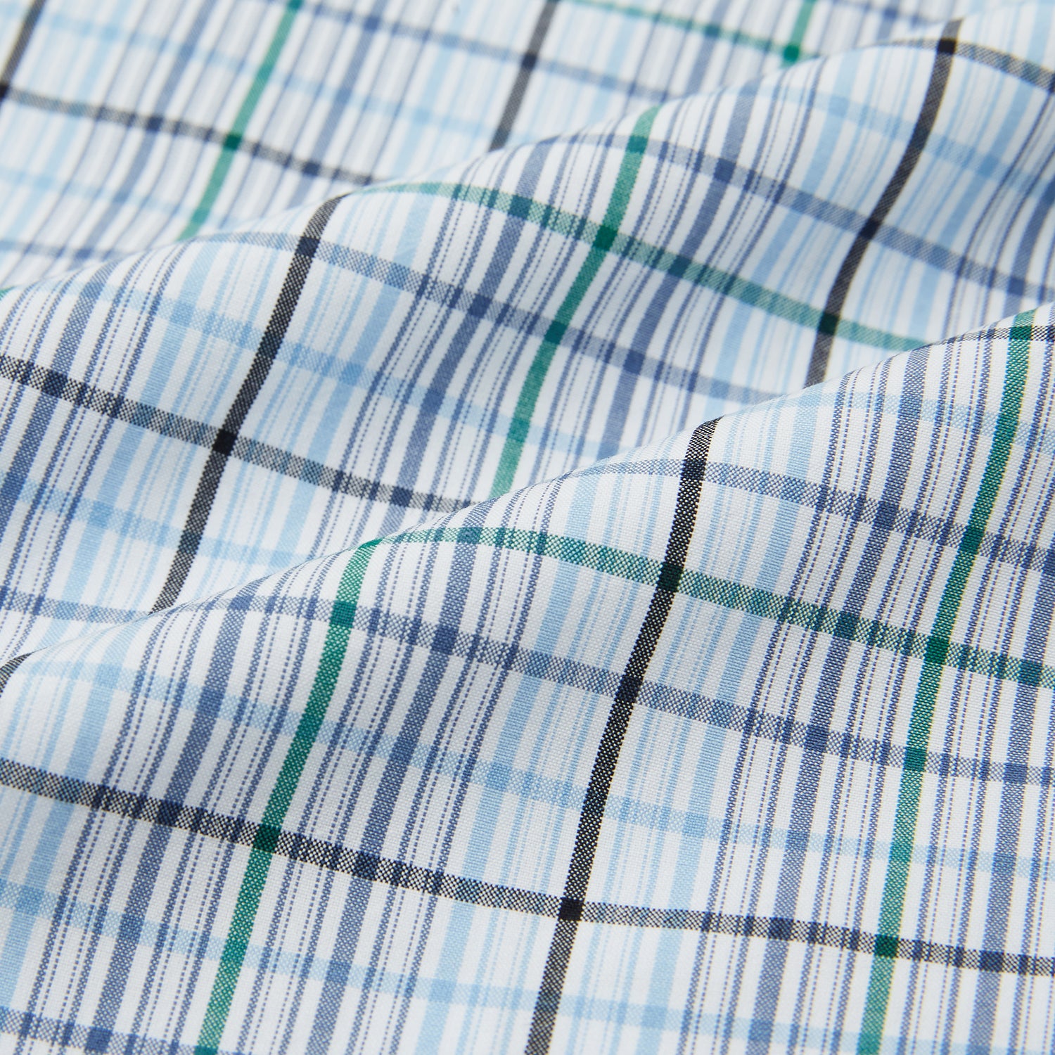 View 5 of product Turnbull & Asser’s Blue and Green Multi Track Check Pyjama Trousers feature an elastic waistband with drawstring and a blue-green check pattern on a white background, shown laid flat on a white surface.