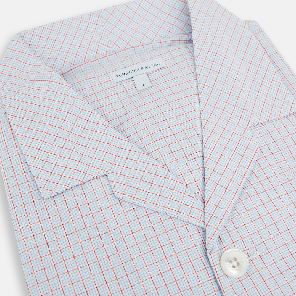 The Turnbull & Asser Red Multi Graph Check Pyjama Shirt is a stylish long-sleeved loungewear piece, ideal for comfortable and elegant nightwear.