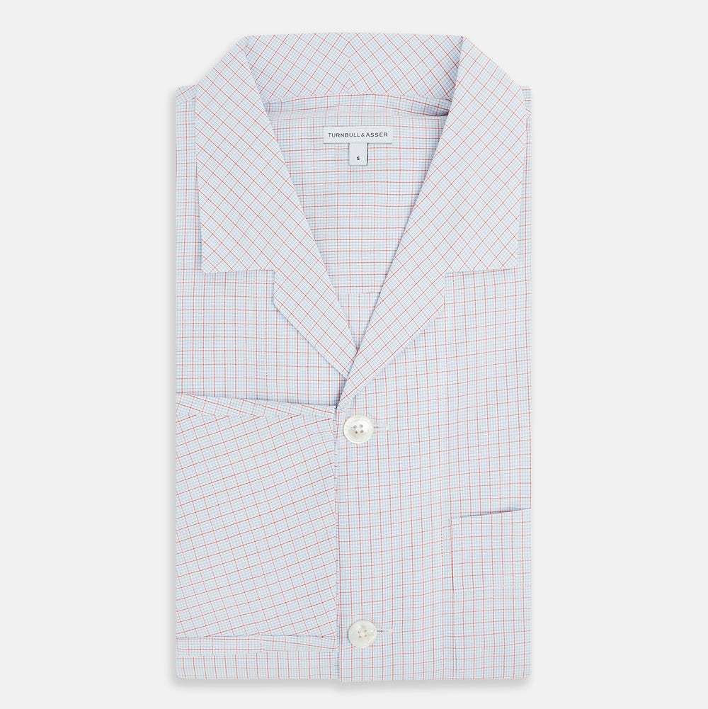 The Turnbull & Asser Red Multi Graph Check Pyjama Shirt is a stylish long-sleeved loungewear piece, ideal for comfortable and elegant nightwear.
