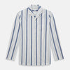 View 1 of product The Turnbull & Asser Blue Blazer Stripe Pyjama Shirt features a collar, chest pocket, and vertical blue, white, and light red stripes—an elegant long-sleeve loungewear piece neatly displayed on a plain white background.
